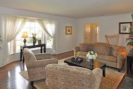 Living Room Bay Window Fireplace Dining Room With Multiple Windows And Window Shutt Living Room Furniture Layout Bay Window Living Room Livingroom Layout