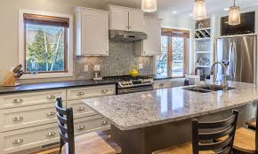 Depending on your kitchen cabinet layout and paint quality, painting professionals may charge between $1,200 and $7,000 to repaint a full kitchen. Painted Kitchen Cabinets And Stained Kitchen Cabinets Compared Degnan Design Build Remodel