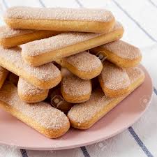 Snacks and cookies / palmeritas & lady fingers cookies. Savoiardi Or Ladyfingers Cookies On A Pink Plate On Cloth Side Stock Photo Picture And Royalty Free Image Image 121430139