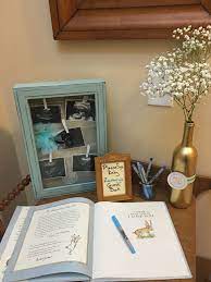 Baby Shower Guest Book And Welcome Table Guests Signed Child S Book Guess How Much I Love You Ready To Baby Shower Book Baby Shower Themes Baby Shower Diy