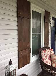My assistant and i hung the shutters on the house using exterior screws through the shutter frame and into the siding. Diy Wood Shutters On Vinyl Siding Dark Wood Decking Stained Doors Window Shutters Diy