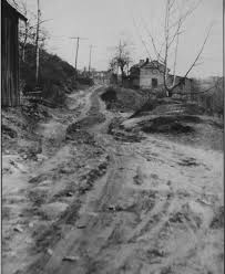 What is the history of the unpaved roads in the 1920s?