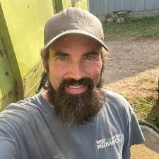 At the base of a tree MN