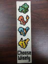 The cover side includes a full color photo of the stitched bookmark. Fo Pokemon Starter Bookmark Crossstitch