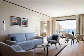 Hardwood and glass coffee table with matching end tables. Riviera Marriott Hotel La Porte De Monaco By Cvl Luminaires Manufacturer References