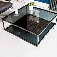 Having a display shelf on the middle shelf that can immediately double as a place to put stuff (i.e. Cubic Industrial Glass Coffee Table With Shelf Klarity Glass Furniture