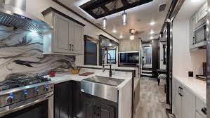 This extended stay rv is a front kitchen fifth wheel with a smaller toy hauler garage area too. Redwood Luxury Fifth Wheels Crossroads Rv