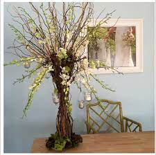 A Tree Centerpiece Of Moss White Flowers Orchids Curly Willow Branches Hanging Votives Natur Tree Centerpieces Hanging Tea Lights Nature Themed Wedding