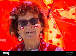 Canada. 01st July, 2022. Eliza Kingdon, all dressed up for Canada Day,  poses for a photo at the Forks in Winnipeg,