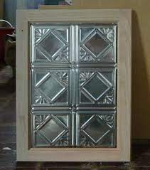 We found all of our hardware for this piece at hobby lobby! Tin Ceiling Tiles Used As Cabinet Door Panels Tin Ceilings Panel Tin Ceiling Tin Panel