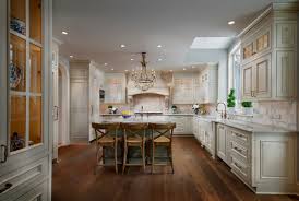 Blue cabinets are set against a white worktop, walls and floors, adding contrast and dimension. 75 Beautiful Dark Wood Floor Kitchen With Beige Cabinets Pictures Ideas June 2021 Houzz