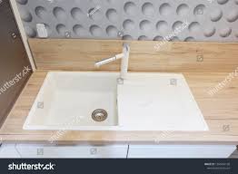white ceramic sink mixer taps on stock