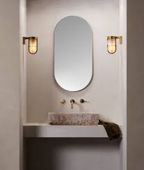 This model uses (1) 60 watt medium base incandescent bulb. Cabin Style Ip44 Rated Wall Light Frosted Glass On A Brass Bronze Or Nickel Bracket Designed For Use Inside Or Out