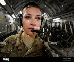 U.S. Air Force Airman 1st Class Georgia Clyde, 816th Expeditionary Airlift  Squadron C-17 Globemaster III loadmaster, directs the movement of cargo  during a mission in support of Operation Inherent Resolve, Oct. 13,