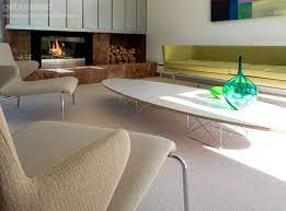 Two wire bases support a long, elegant, oval top covered in black laminate. Eames Etr Elliptical Surfboard Coffee Table Platinum Replica Surfboard Coffee Table Coffee Table Home Decor