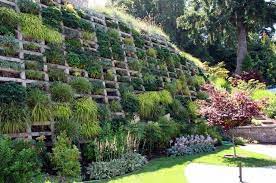 Hold back a hillside, level a steep slope and enjoy more outdoor living space or a decorative garden. 95 Retaining Wall Ideas That Will Blow Your Mind Slope Landscaping Sloped Garden Steep Slope Landscaping