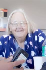 Can someone remove the scratch from the old photo?