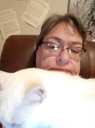 Can someone photoshop a cigarette in the cat's hand?