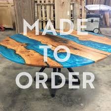 Everyone faces each other around a round table and you can make room for socializing by simply adding a leaf. Cherry And Epoxy Round Dining Table Timberwolf Slabs