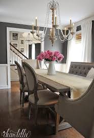 A charcoal gray dining bench and blue velvet dining chairs sit around a rustic oak dining table positioned behind a kitchen island. Gray Tufted Dining Bench French Dining Room Benjamin Moore Kendall Charcoal