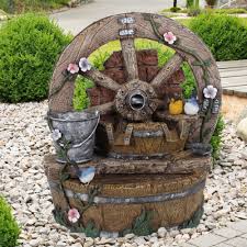 Zierbrunnen sind die optimale lösung, wenn es darum geht, die atmosphäre eines standorts zu verbessern. Zierbrunnen Garten Holz Rad Optik Stein