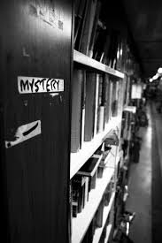 Black literature and the white aesthetic. Premium Photo Black And White Perspective Depth Shot Of A Row Of Books In The Mystery Section Of A Library Or Book