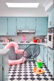 Spacious kitchen room with light brown cabinets and black granite counter tops. Bringing Light Into The Kitchen Bright Green Door