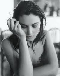 A model wearing one of the first bikinis, by Emilio Pucci, in 1955, lying  among the Roman mosaics of the "Girls in Bikini" in the Villa del Casale in  Piazza Armerina, dating