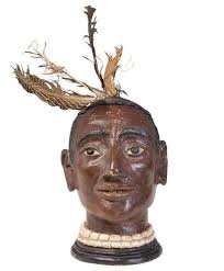 One of my first chainsaw sculptures.. native American skull and headdress,  Chinese elm I believe...