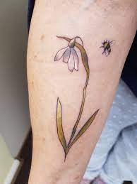 My Latest Tattoo Watercolour Effect Snowdrop With The Cutest Tiny Bee Tattoo Tattoos Latest Tattoos Flower Tattoos