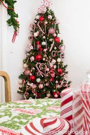 It's just a tomato cage tied together with christmas lights! Candy Cane Space Saving Christmas Tree Tried True Creative