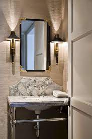 The italian marble top is a classic touch in any bathroom, while the base with its minimalist drawers and clean lines shows off a contemporary silhouette. Powder Room Vanity With Curved Marble Backsplash Transitional Bathroom