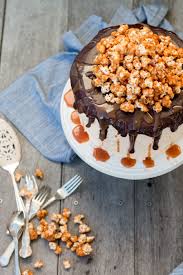 Triple Layer Chocolate Cake With Salted Caramel Buttercream Frosting Chocolate Ganache And Caramel Popcorn Recipe Chocolate Layer Cake Caramel Buttercream Cake Recipes
