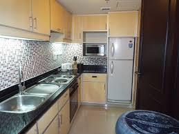 Unverified small table in a room not dedicated to dining, esp. Kitchen Area Of The Suite Taken Through The Pass Through Window Into The Dining Area Picture Of Hotel Borobudur Jakarta Tripadvisor