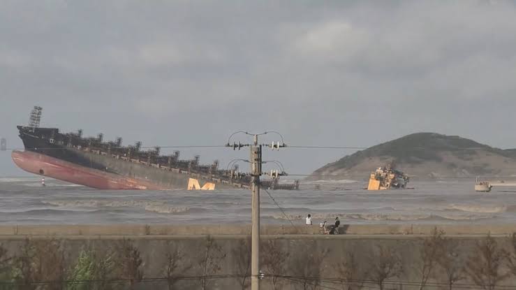 Incredible pics show huge container ship sticking out of water after vessel  runs aground and sinks during storm