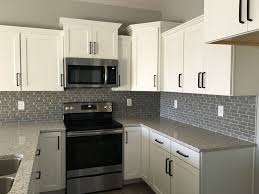 These cabinets are available at an affordable price. White And Grey Kitchen Kitchen Cabinets Grey And White Black And Grey Kitchen Black Appliances Kitchen