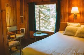 The apgar village lodge cabins is made up of 28 cabins and 20 motel rooms that sit nestled among old growth cedar trees. Apgar Village Lodge Cabins Stay Inside Glacier National Park