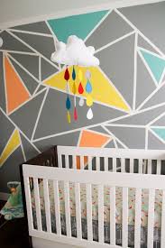 Lowe's® has everything you need to find the paint colors and finishes for your project. Archer S Colorful Nursery With Geometric Elements Nursery Colors Wall Paint Designs Geometric Wall Paint