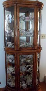 Display your best china but don't go overboard. Vintage Curio Full Of Tea Cups Bookcase With Glass Doors Vintage Bookcase Glass Door