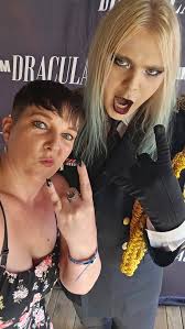 A mix of heavy eyeliner, leather, and dark denim moved before me in waves  of undulating flesh, as if to the command of some fevered hive mind. In the  flashes of neon,