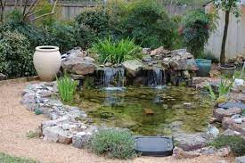 Looking to add a water feature to your garden? Pin By Sublimewatergarden On Water Gardens Koi Ponds Pond Landscaping Ponds Backyard Pond Landscaping Ideas
