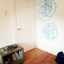 blue roses made of tape on the far wall tape wall art washi tape wall art painters tape design wall