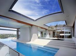 Just Watching The Clouds Pass On By Indoor Outdoor Pool Cool House Designs House Design