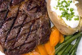 Heat skillet with beef fat over medium. A Grilled Ribeye Steak With A Baked Potato And Vegetables Stock Photo Picture And Royalty Free Image Image 897406