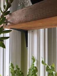 I bought a 1″ x 8″ x 6′ pine board and cut it to length with a miter. Diy Window Plant Shelf Hometalk