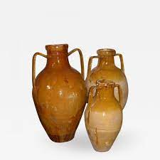 Family oleaceae), a traditional tree crop of the mediterranean basin, produced by pressing whole olives and extracting the oil. Southern Italian Terra Cotta Olive Oil Jars