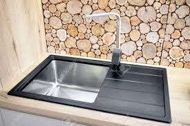 Is your kitchen in need of an overhaul? Modern Design Chrome Water Tap Over Stainless Steel Kitchen Sink Stock Photo Picture And Royalty Free Image Image 143706018