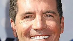 Simon Cowell pays off mortgage of sick girl's family