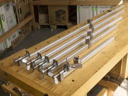 Hang clamps on the wall using caps. Wooden Woodworking Clamps