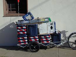 A trailer that you can tow with your motorcycle and put your cargo in (as opposed to a trailer the you put your motorcycle in) is commonly referred to as simply a motorcycle cargo trailer. Bicycle Trailer Wikipedia